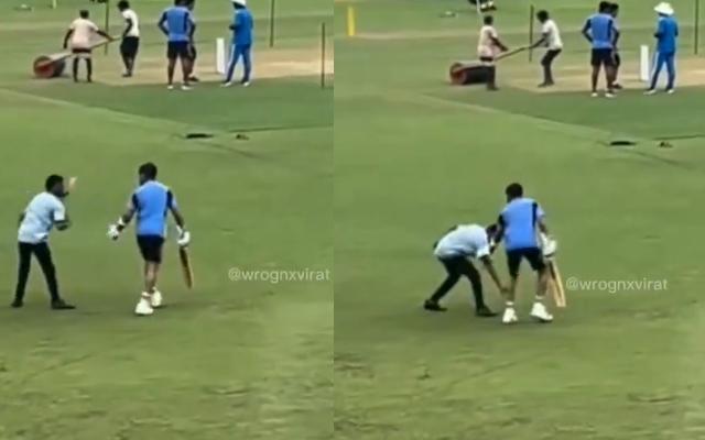 Ground staff touches Kohli's feet