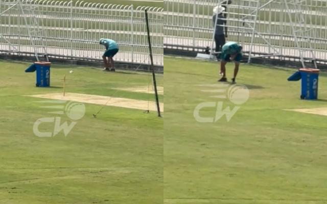 Jason Gillespie picks used water bottle after training